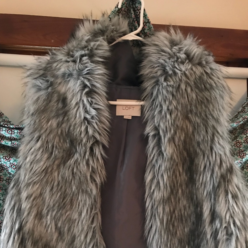 Hooded short fur vest. Great with dresses!